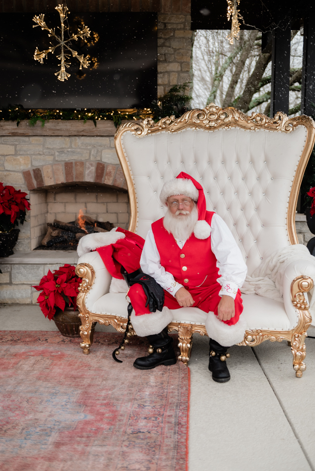 Santa Jim wearing a red vest ensemble by Angie's Originals