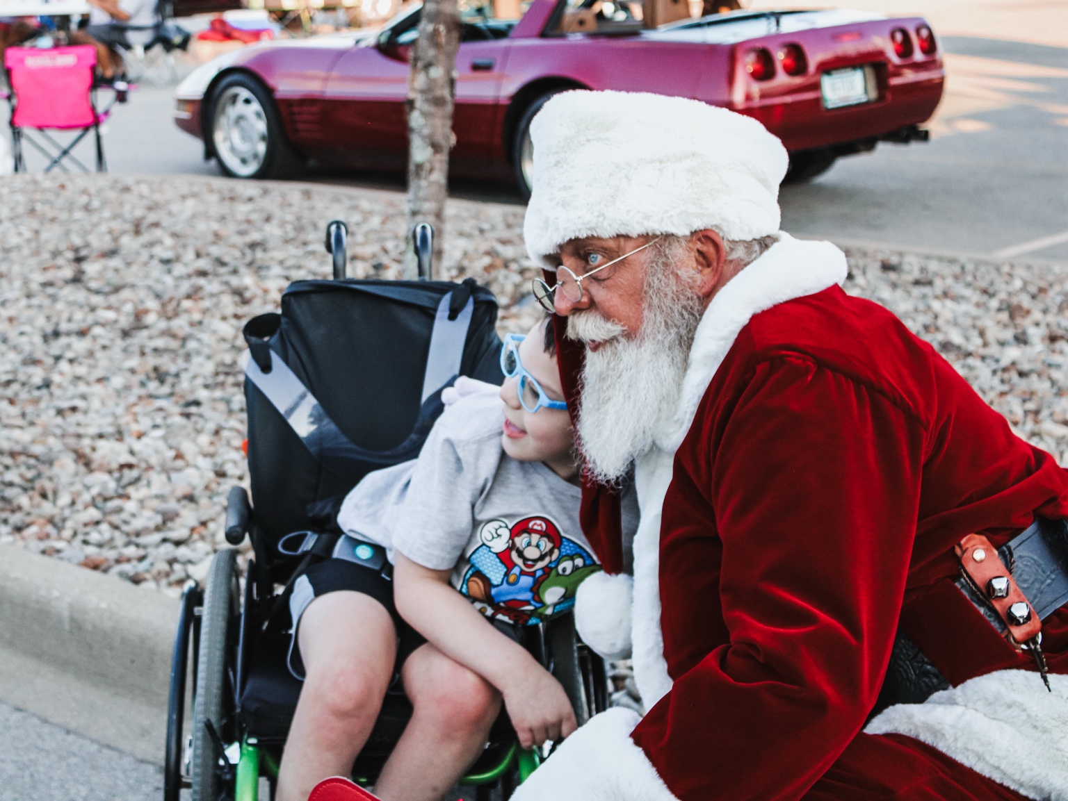 Santa Jim greeting a child
